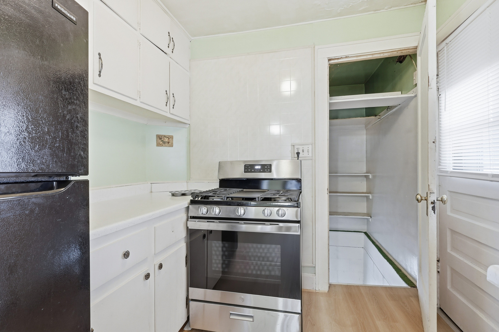 2748 12th Avenue Moline, IL 61265 - Photo 18 of 35 a kitchen with a stove and a microwave