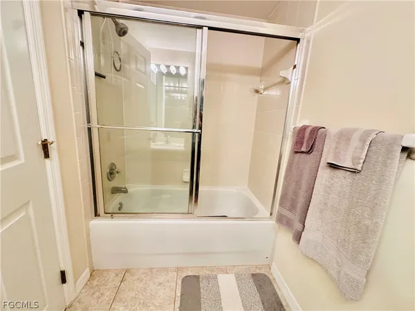 a bathroom with a shower and a tub