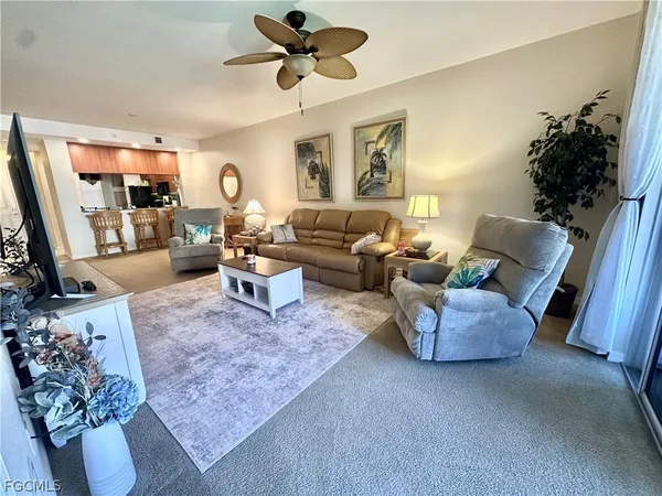 a living room with furniture and a rug