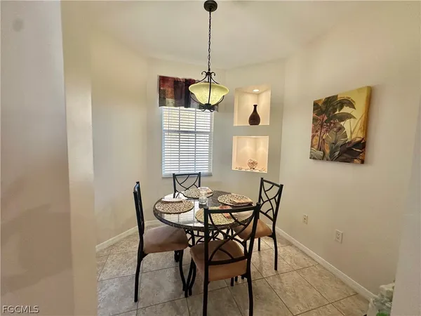 a dining room with furniture and window