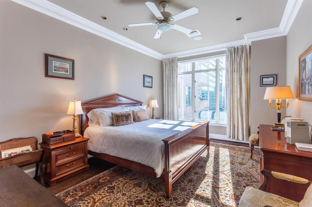 2525 North Pearl Street, Unit 1105 Dallas, TX 75201 - Photo 13 of 38 a bedroom with a bed table and window