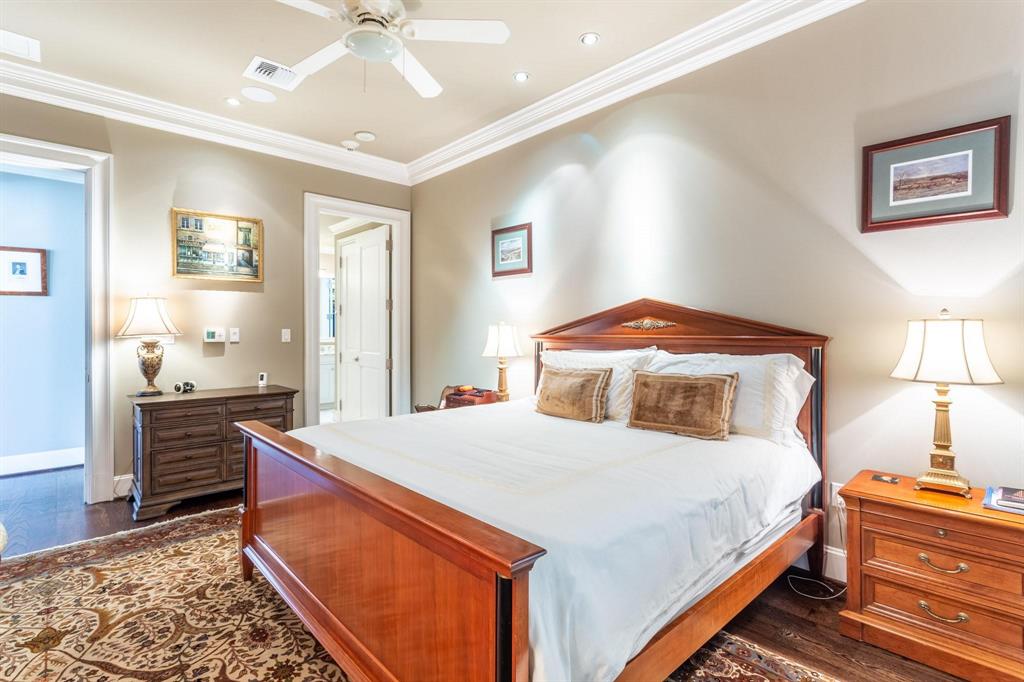 2525 North Pearl Street, Unit 1105 Dallas, TX 75201 - Photo 15 of 38 a bedroom with a bed and wooden floor