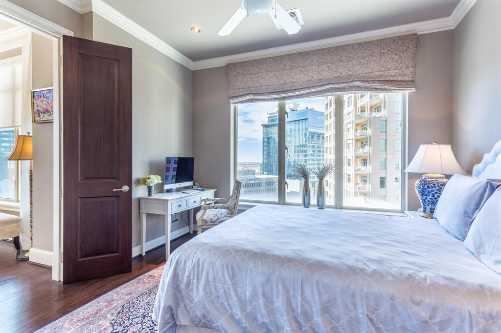 2525 North Pearl Street, Unit 1105 Dallas, TX 75201 - Photo 19 of 38 a bedroom with a large bed and a large window