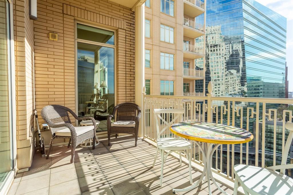 2525 North Pearl Street, Unit 1105 Dallas, TX 75201 - Photo 24 of 38 a view of a chair and a table in the balcony