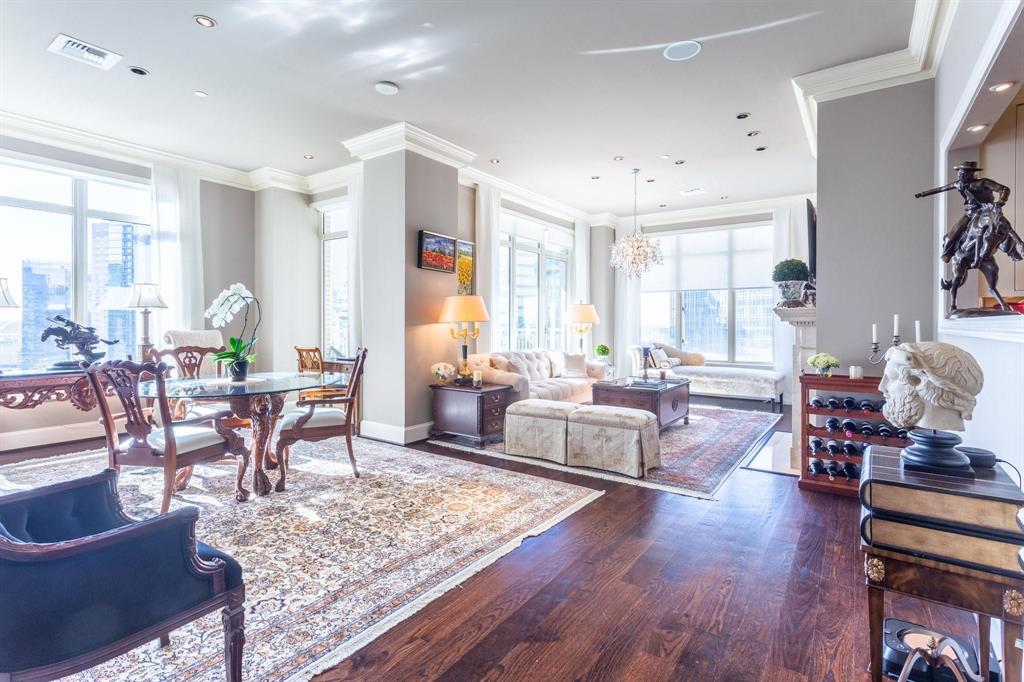 2525 North Pearl Street, Unit 1105 Dallas, TX 75201 - Photo 4 of 38 a living room with furniture and a wooden floor