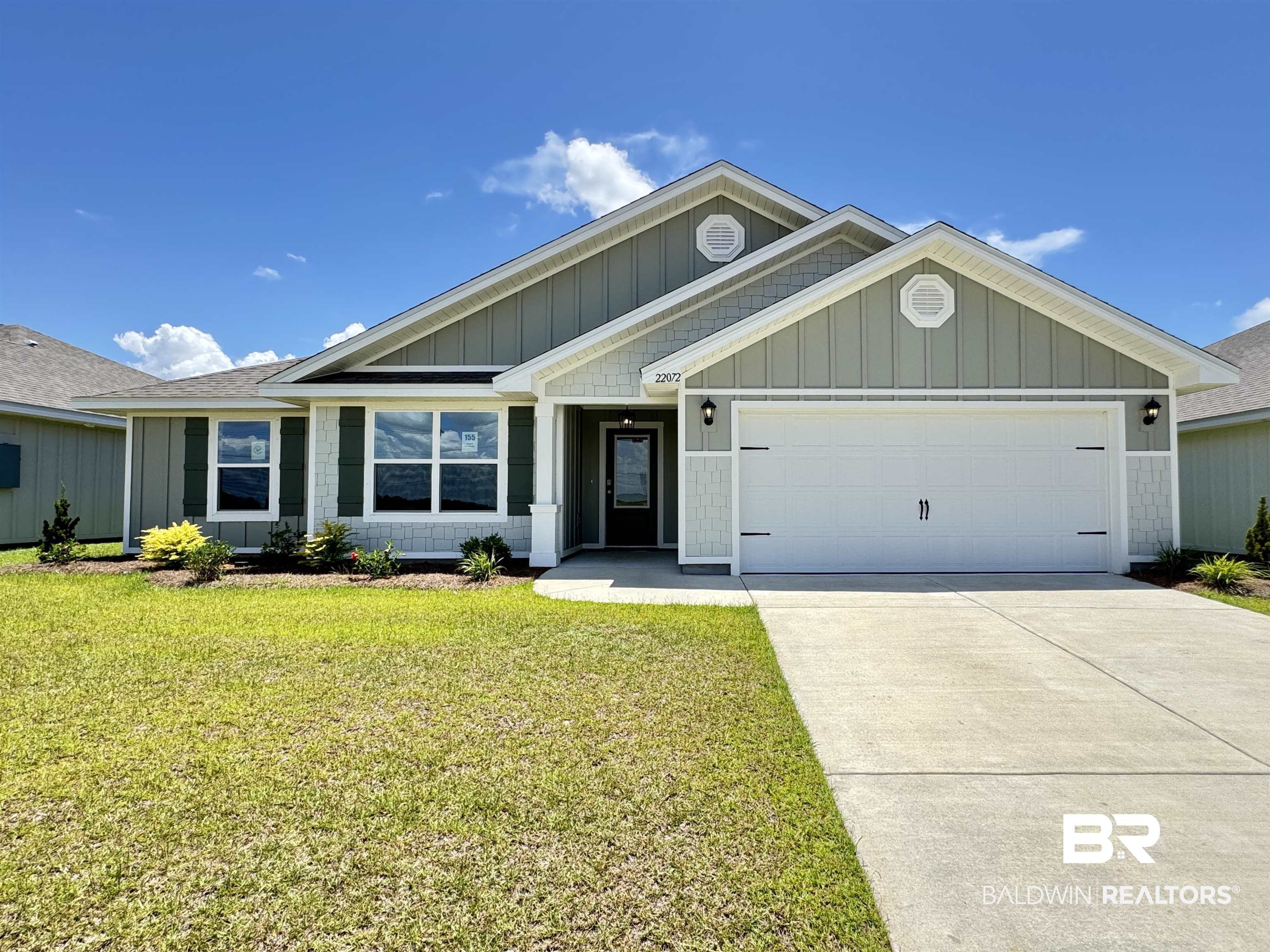 22072 Aleutian Avenue Foley, AL 36535 - Photo 1 of 47 View of front facade with an attached garage, driveway, a front yard, and roof with shingles