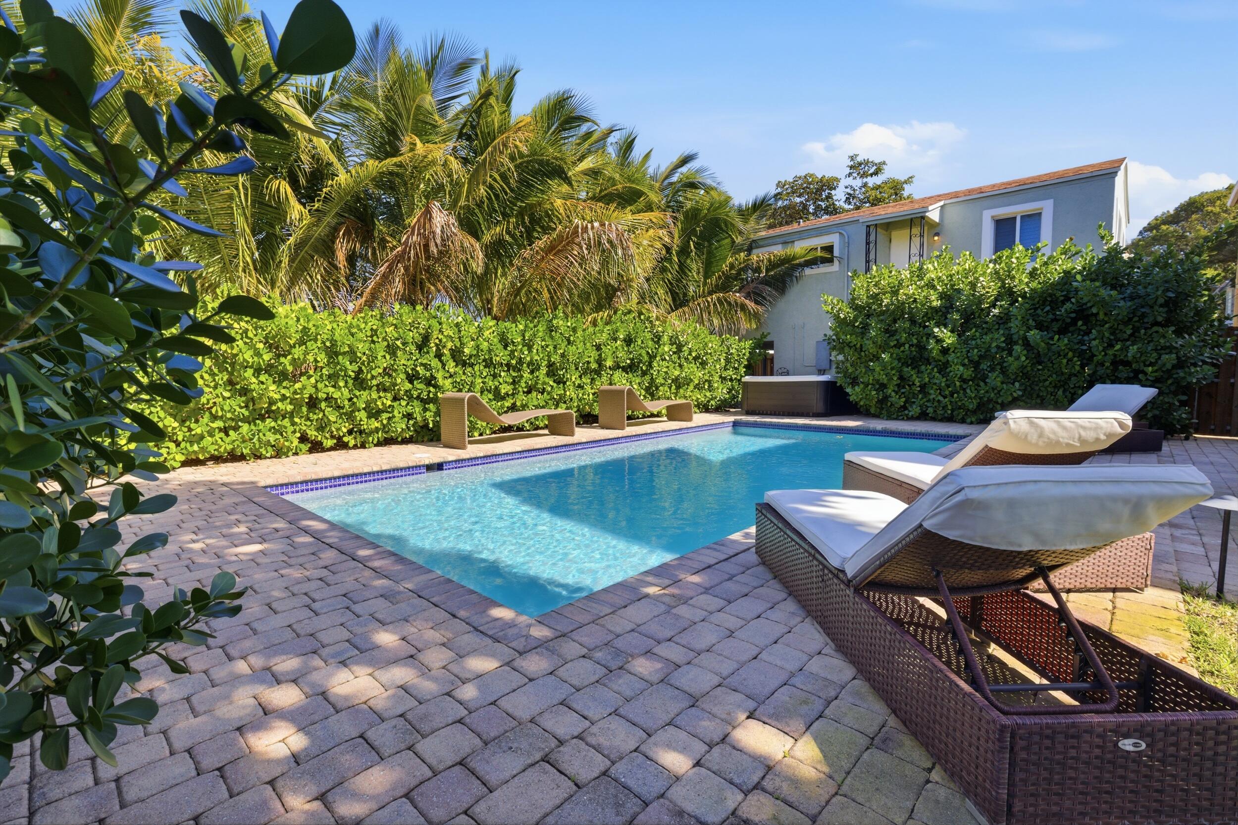 921 Ortega Road West Palm Beach, FL 33405 - Photo 41 of 60 a view of a chairs in a backyard