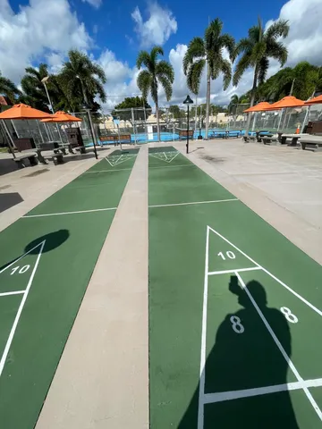 a view of a cars park on the side of a road