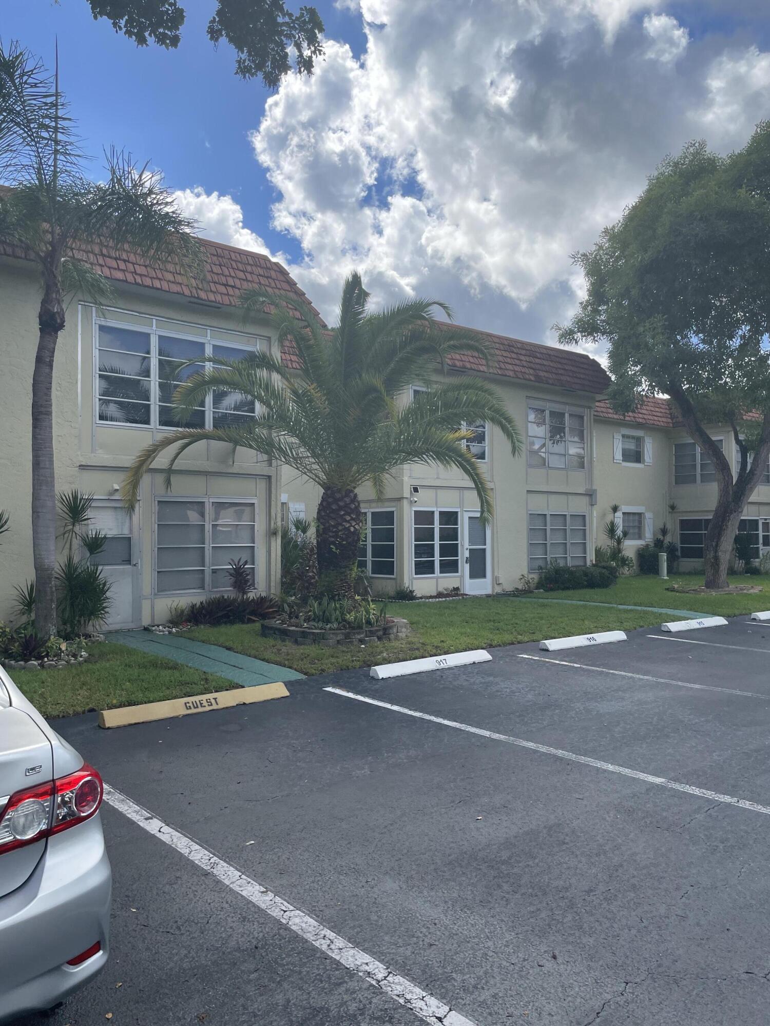375 Southwest 56th Avenue, Unit 217 Margate, FL 33068 - Photo 13 of 15 a view of a large trees in front of a house