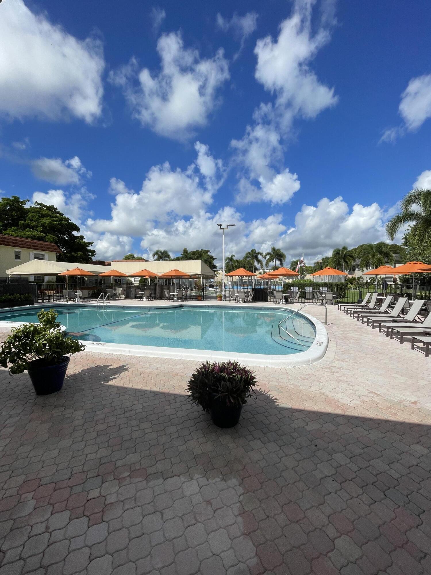 375 Southwest 56th Avenue, Unit 217 Margate, FL 33068 - Photo 14 of 15 a view of a swimming pool and lake view