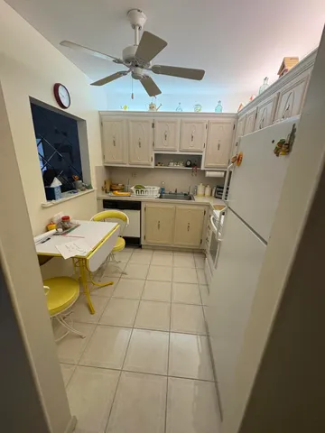 a kitchen with a cabinets and appliances