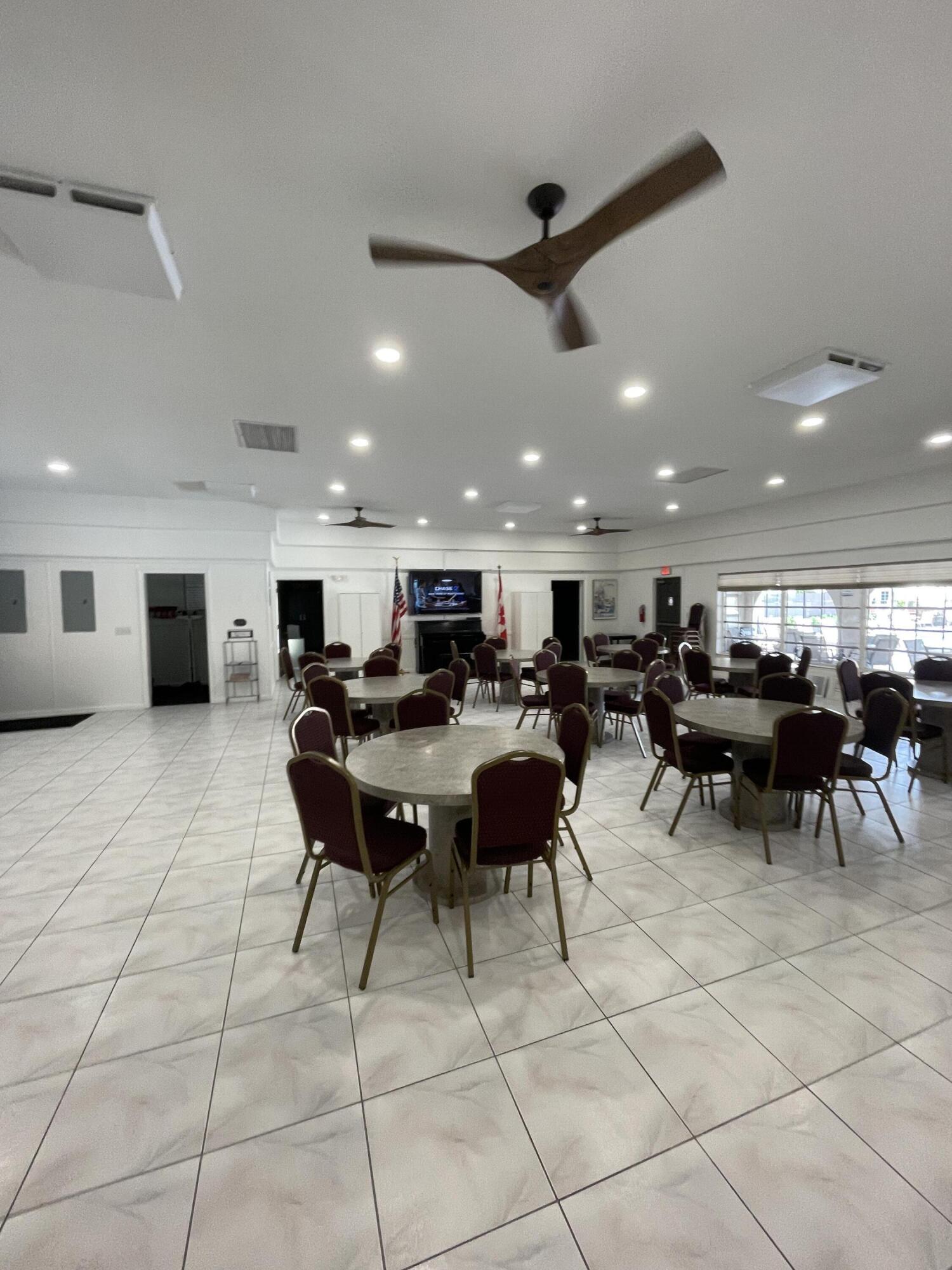 375 Southwest 56th Avenue, Unit 217 Margate, FL 33068 - Photo 8 of 15 a group of people sitting in a living room