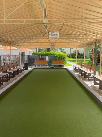 a view of an outdoor space and basketball court