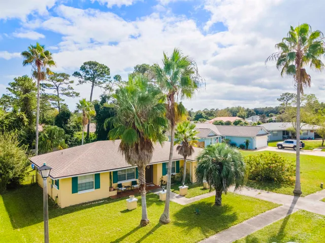 a view of a house with swimming pool and porch with furniture