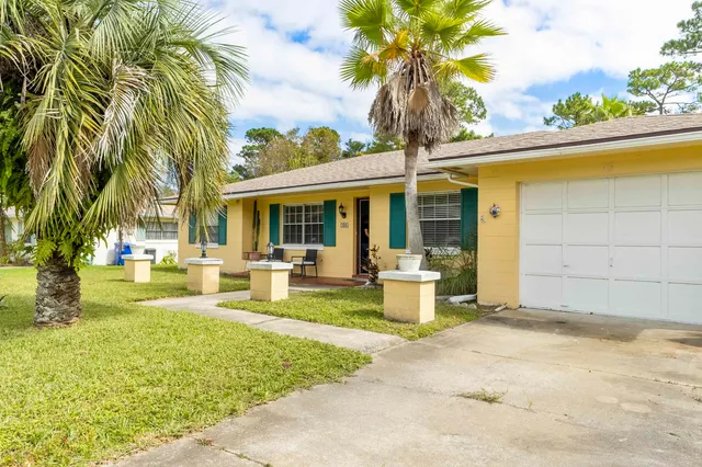 a view of a house with swimming pool and porch