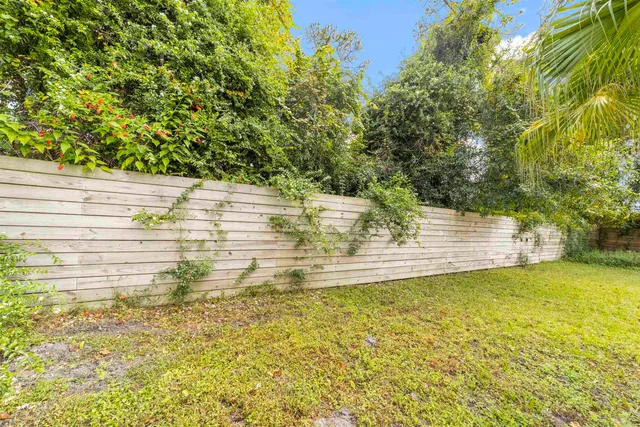 a front view of a house with swimming pool having outdoor seating