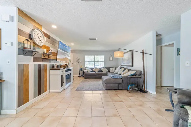 a kitchen with a sink a stove and cabinets