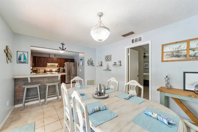 a kitchen with a sink stove top oven and cabinets