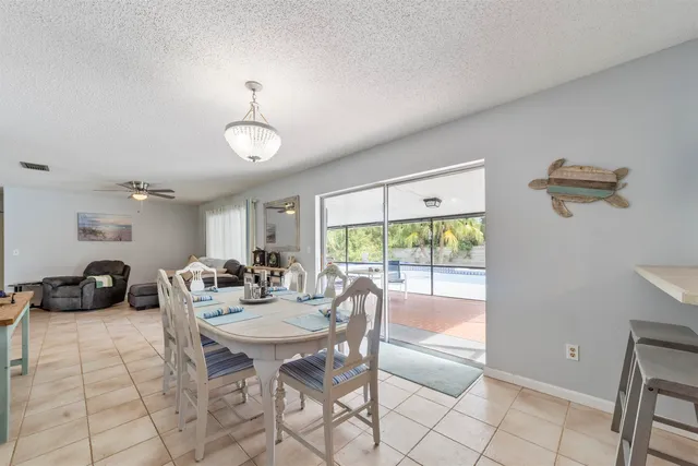 a kitchen with kitchen island a counter top space appliances and cabinets