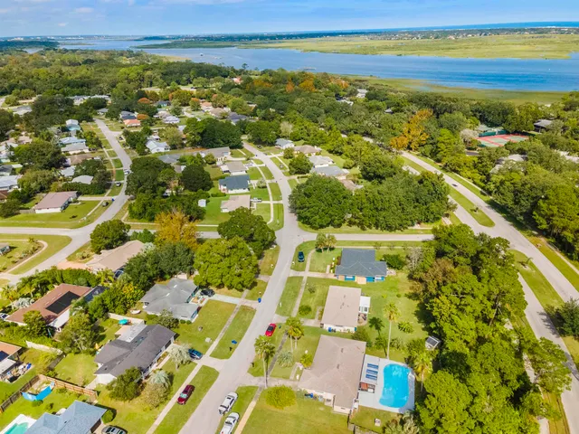 an aerial view of residential houses with outdoor space