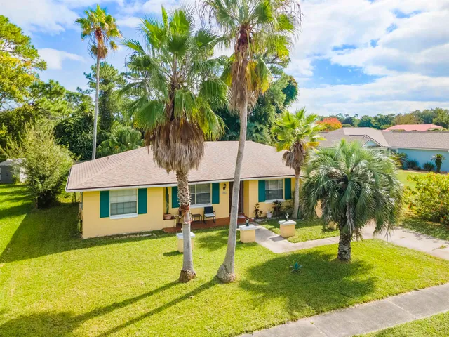 a view of a house with swimming pool and a porch with furniture