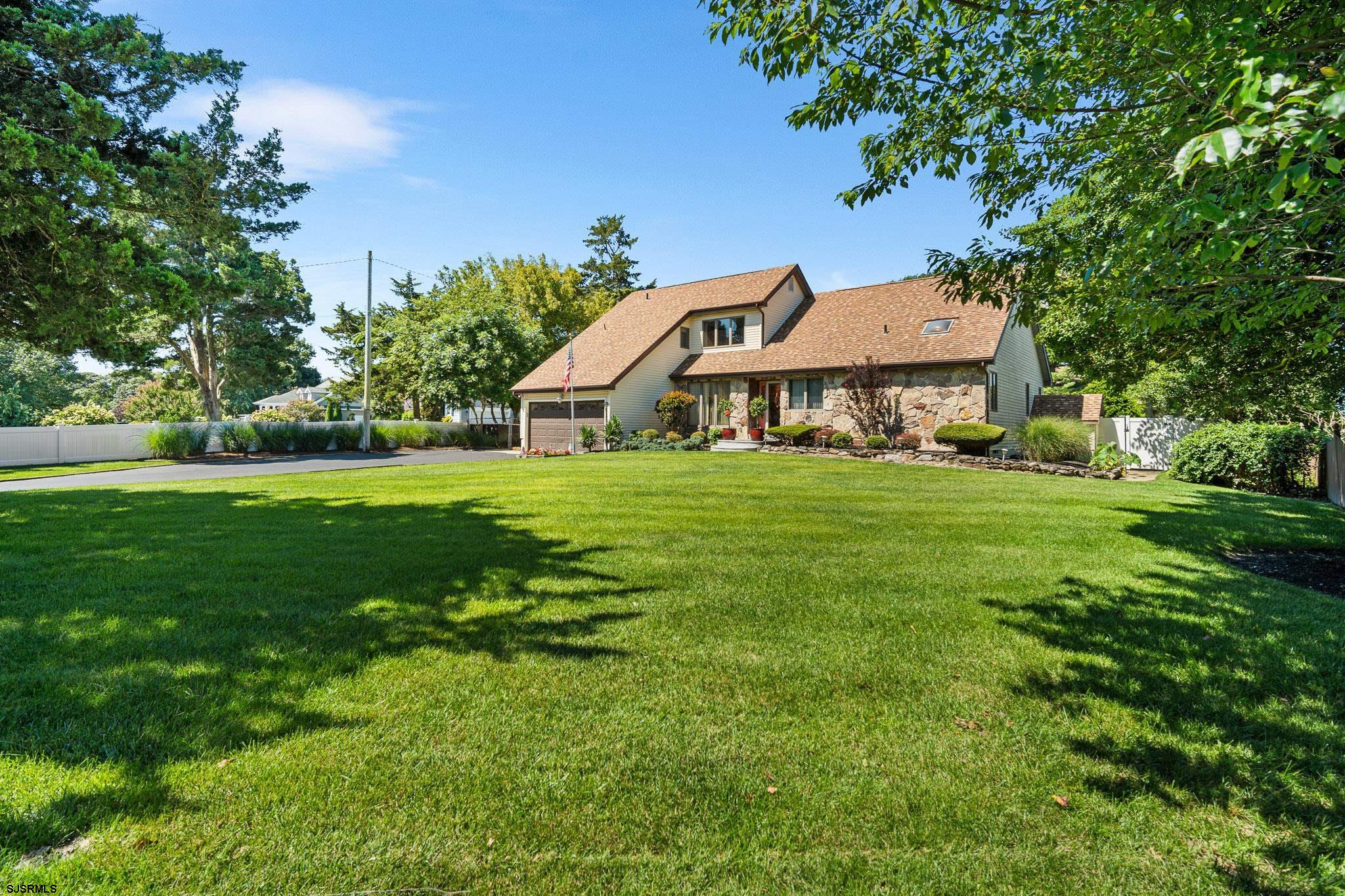 202 North Shore Road Marmora, NJ 08223 - Photo 2 of 31 a view of a house with a big yard