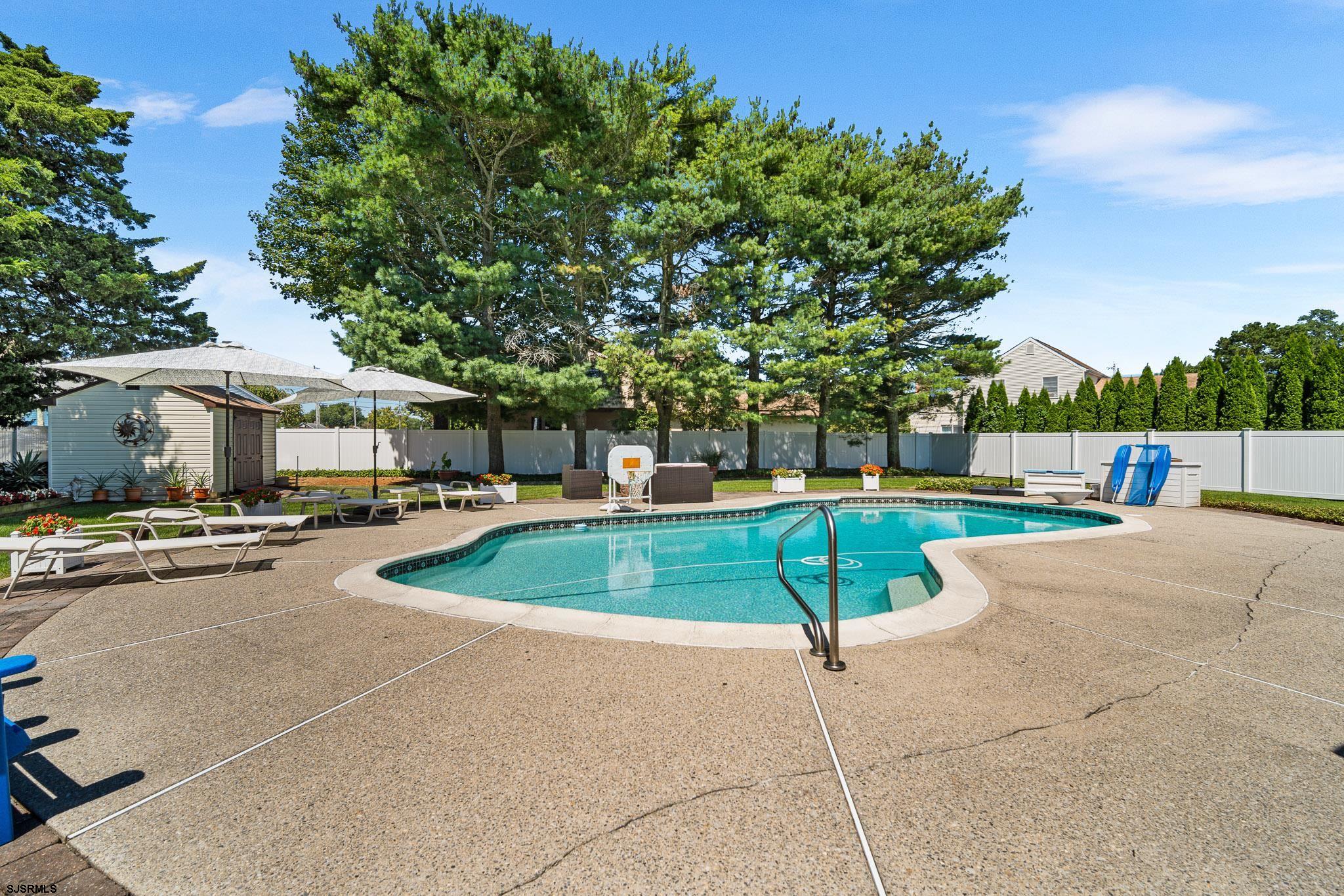 202 North Shore Road Marmora, NJ 08223 - Photo 10 of 31 a view of a swimming pool with a patio