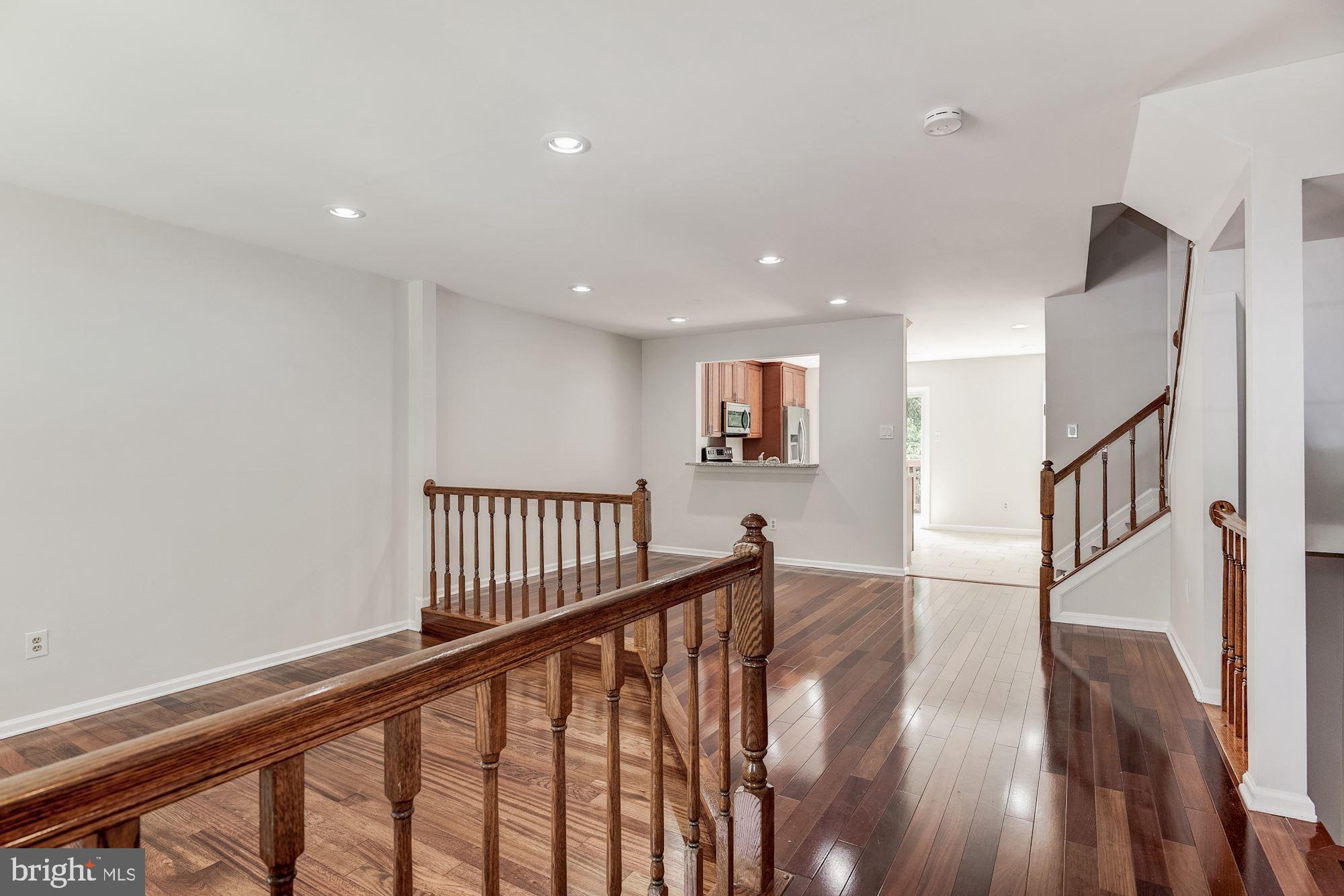 4685 Columbia Road Ellicott City, MD 21042 - Photo 2 of 32 Open main level with Brazilian cherry hardwoods