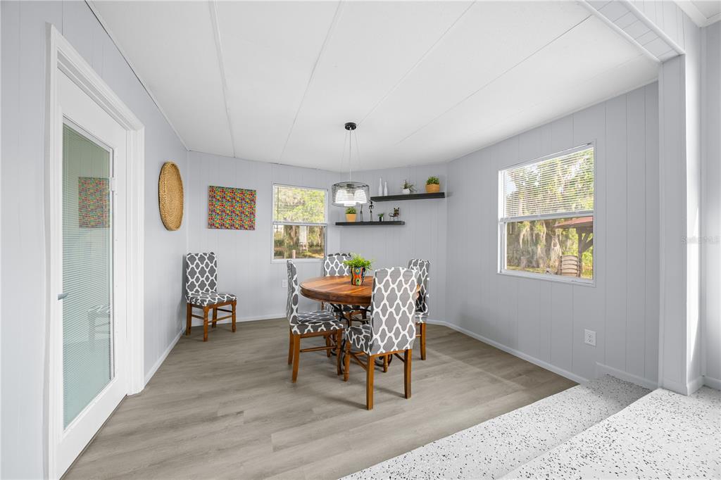 426 Northwest 5th Road Lake Panasoffkee, FL 33538 - Photo 11 of 51 a living room with furniture and a wooden floor
