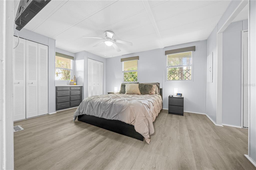 426 Northwest 5th Road Lake Panasoffkee, FL 33538 - Photo 12 of 51 a spacious bedroom with a bed and a window