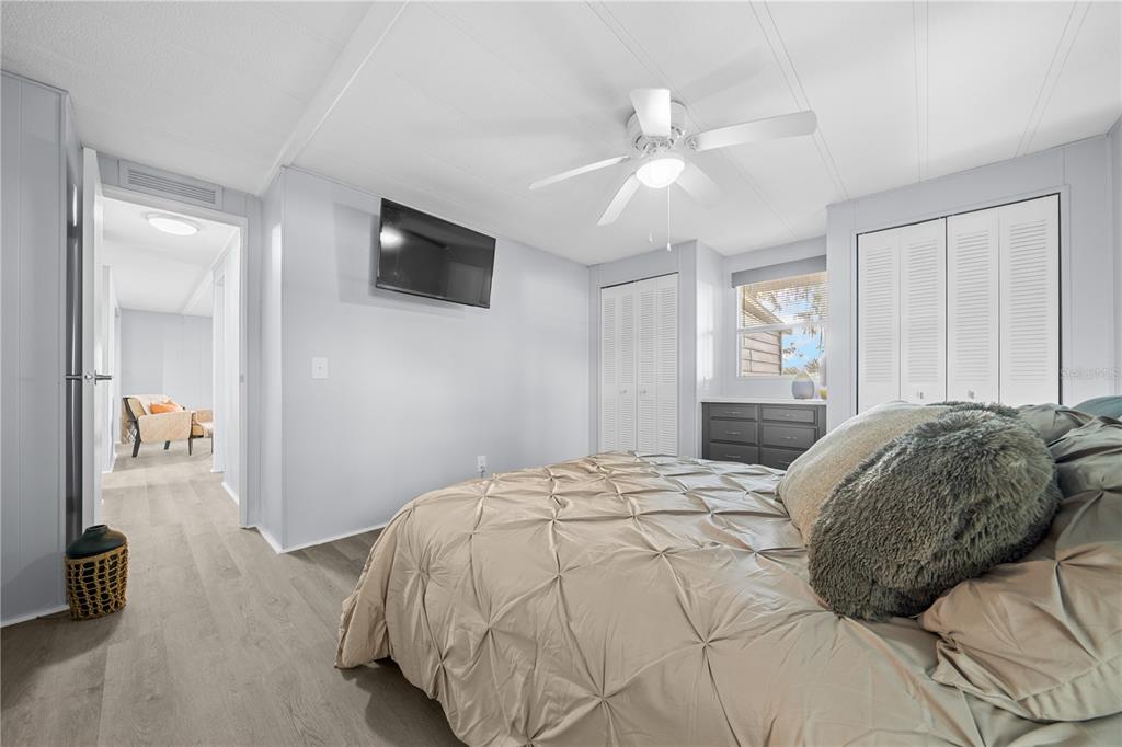 426 Northwest 5th Road Lake Panasoffkee, FL 33538 - Photo 15 of 51 a bedroom with a bed and a flat screen tv