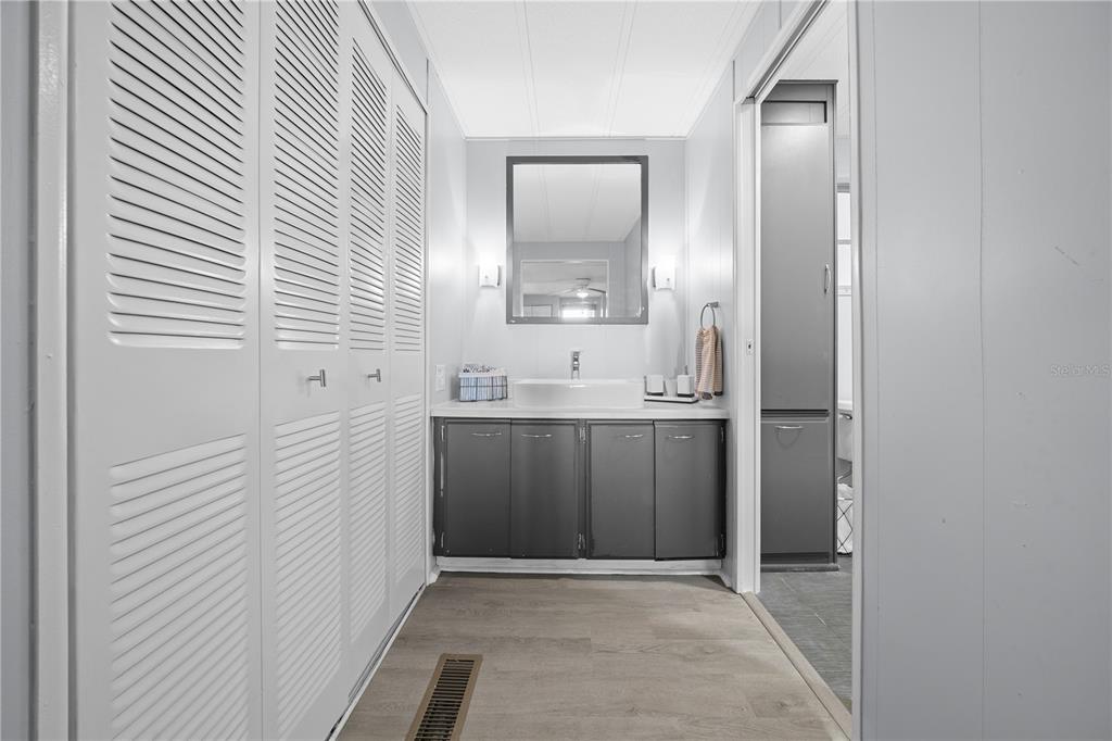 426 Northwest 5th Road Lake Panasoffkee, FL 33538 - Photo 16 of 51 a bathroom with a sink a mirror and a window