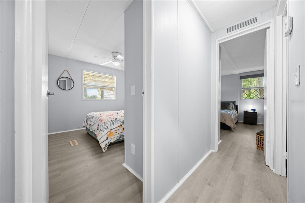 426 Northwest 5th Road Lake Panasoffkee, FL 33538 - Photo 19 of 51 a view of a bedroom bed and a window