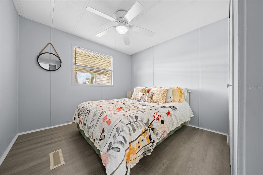 426 Northwest 5th Road Lake Panasoffkee, FL 33538 - Photo 20 of 51 a bedroom with a bed and a window