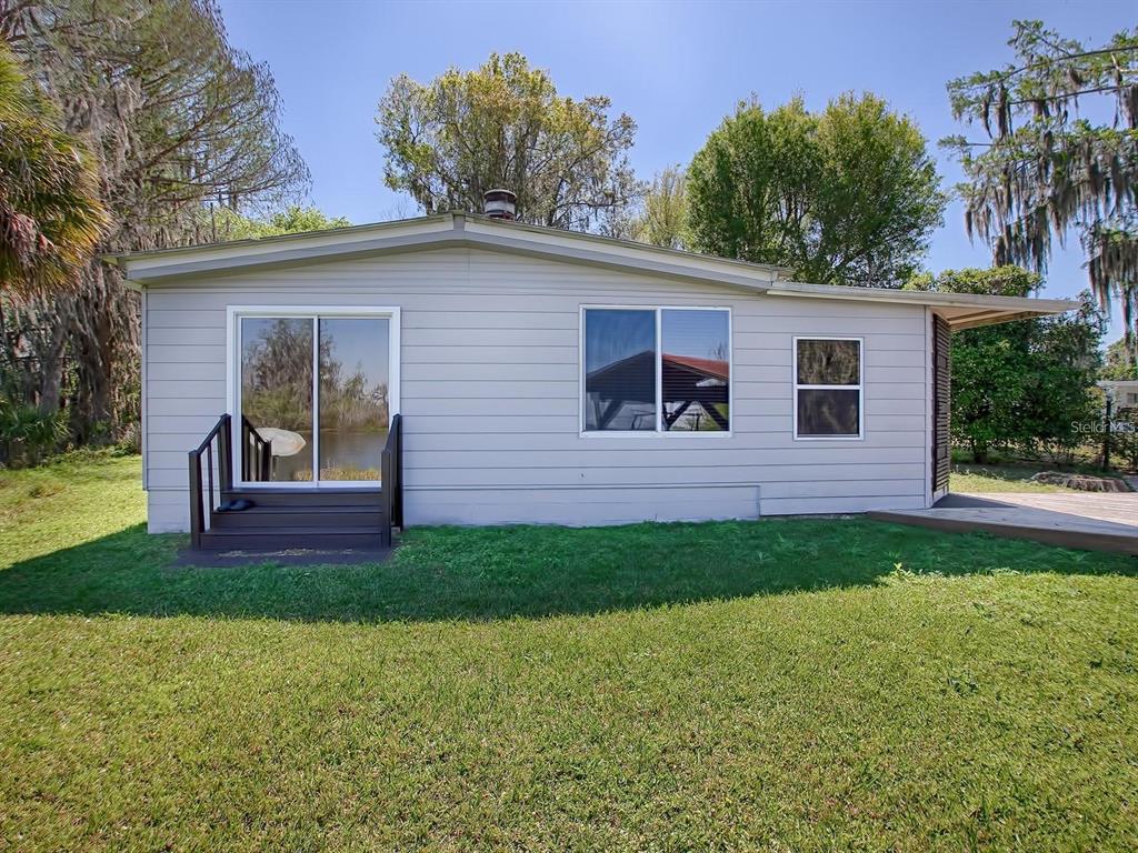 426 Northwest 5th Road Lake Panasoffkee, FL 33538 - Photo 2 of 51 a view of outdoor space yard and deck