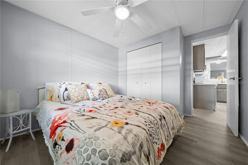 426 Northwest 5th Road Lake Panasoffkee, FL 33538 - Photo 21 of 51 a bedroom with a bed and a chandelier