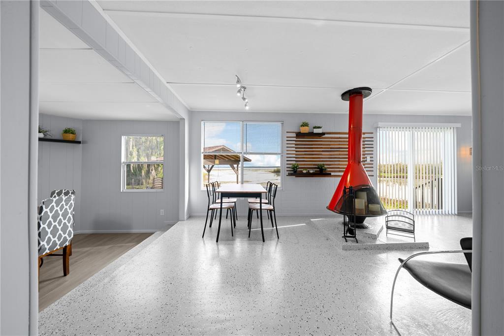 426 Northwest 5th Road Lake Panasoffkee, FL 33538 - Photo 25 of 51 a living room with furniture and a large window