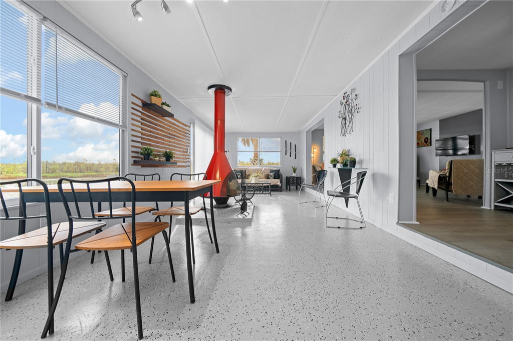 426 Northwest 5th Road Lake Panasoffkee, FL 33538 - Photo 27 of 51 a living room with furniture and a large window