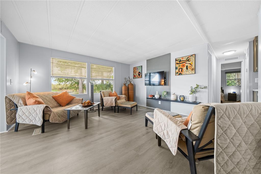 426 Northwest 5th Road Lake Panasoffkee, FL 33538 - Photo 33 of 51 a living room with furniture and a large window