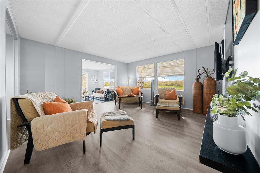 426 Northwest 5th Road Lake Panasoffkee, FL 33538 - Photo 34 of 51 a living room with furniture and a large window