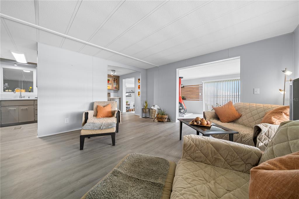 426 Northwest 5th Road Lake Panasoffkee, FL 33538 - Photo 35 of 51 a living room with furniture and wooden floor