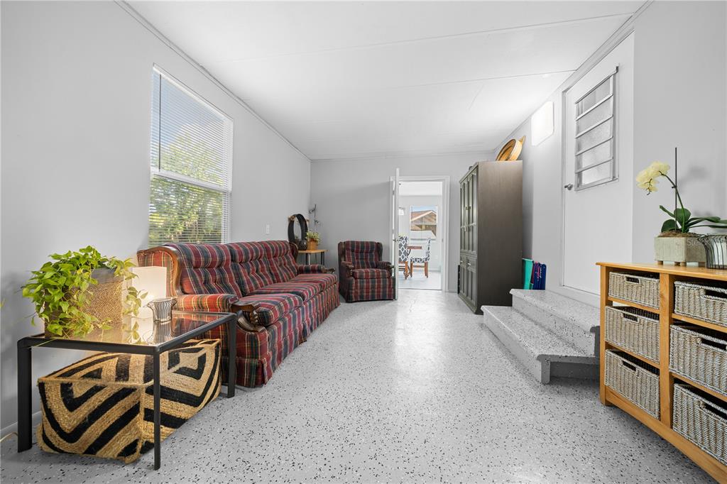 426 Northwest 5th Road Lake Panasoffkee, FL 33538 - Photo 38 of 51 a living room with furniture and a window