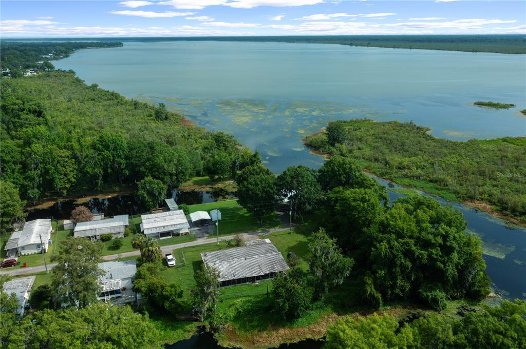 426 Northwest 5th Road Lake Panasoffkee, FL 33538 - Photo 47 of 51 a view of a lake with a yard