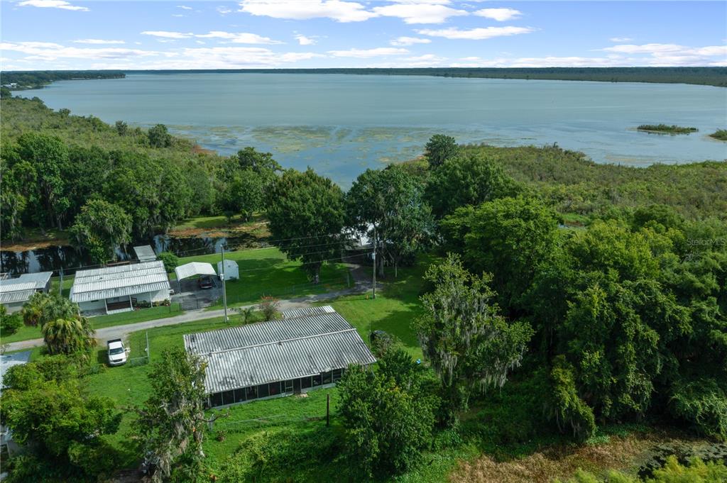 426 Northwest 5th Road Lake Panasoffkee, FL 33538 - Photo 48 of 51 a view of a water pond with green yard