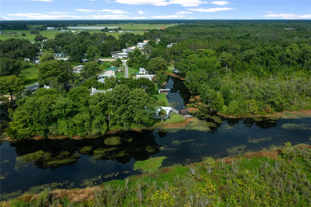 426 Northwest 5th Road Lake Panasoffkee, FL 33538 - Photo 50 of 51 a view of a garden with a lake