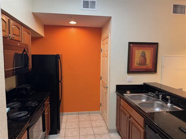 a view of a hallway with workspace and a window