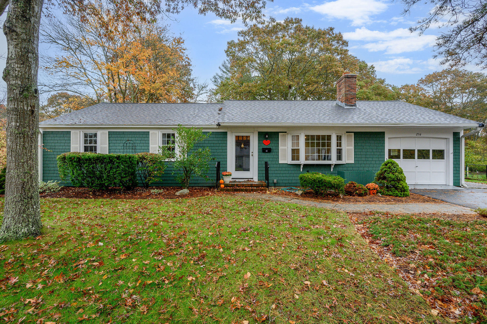 front view of a house with a yard