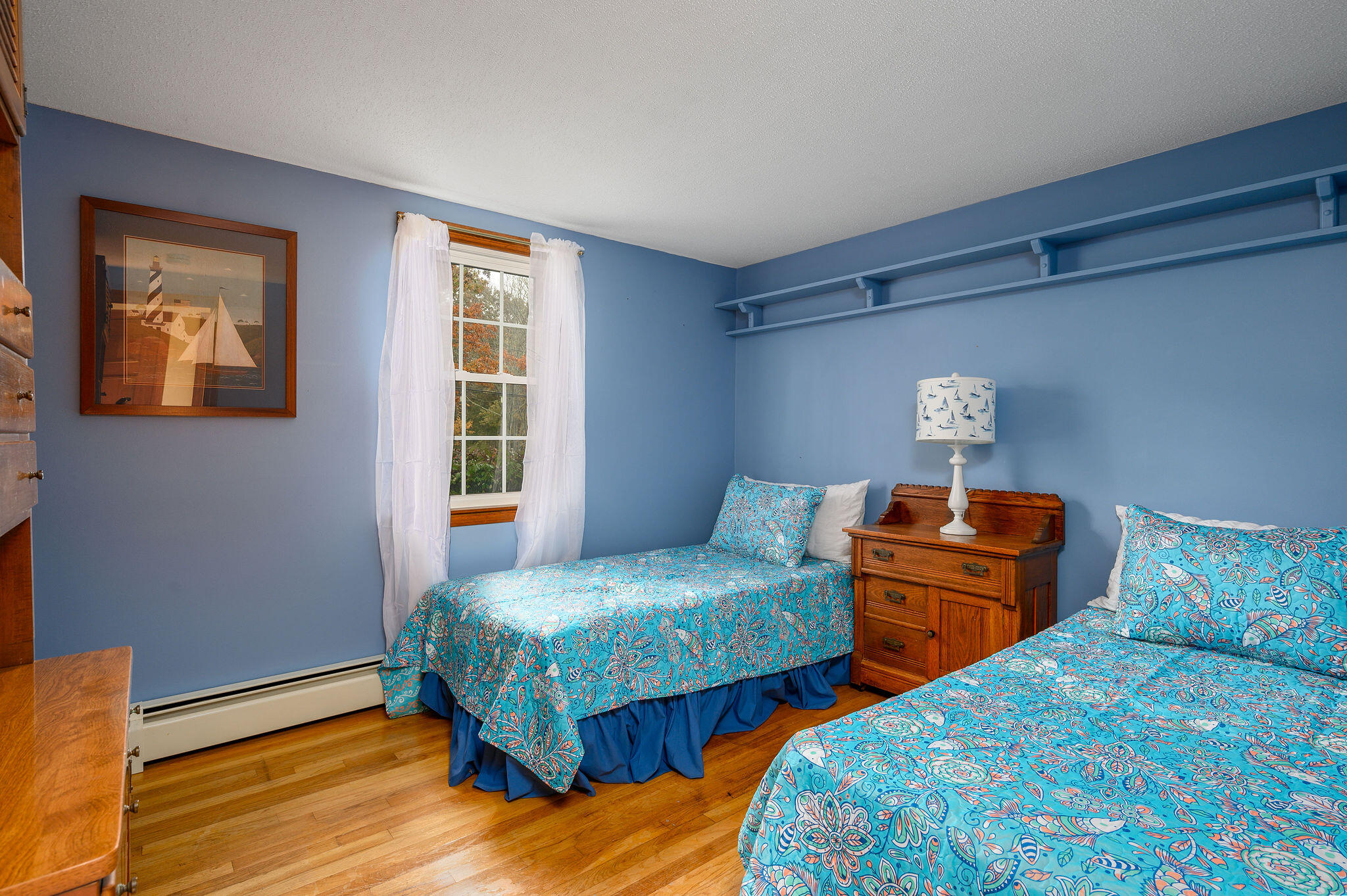 256 Buckskin Path Centerville, MA 02632 - Photo 16 of 38 a bedroom with two beds and wooden floor