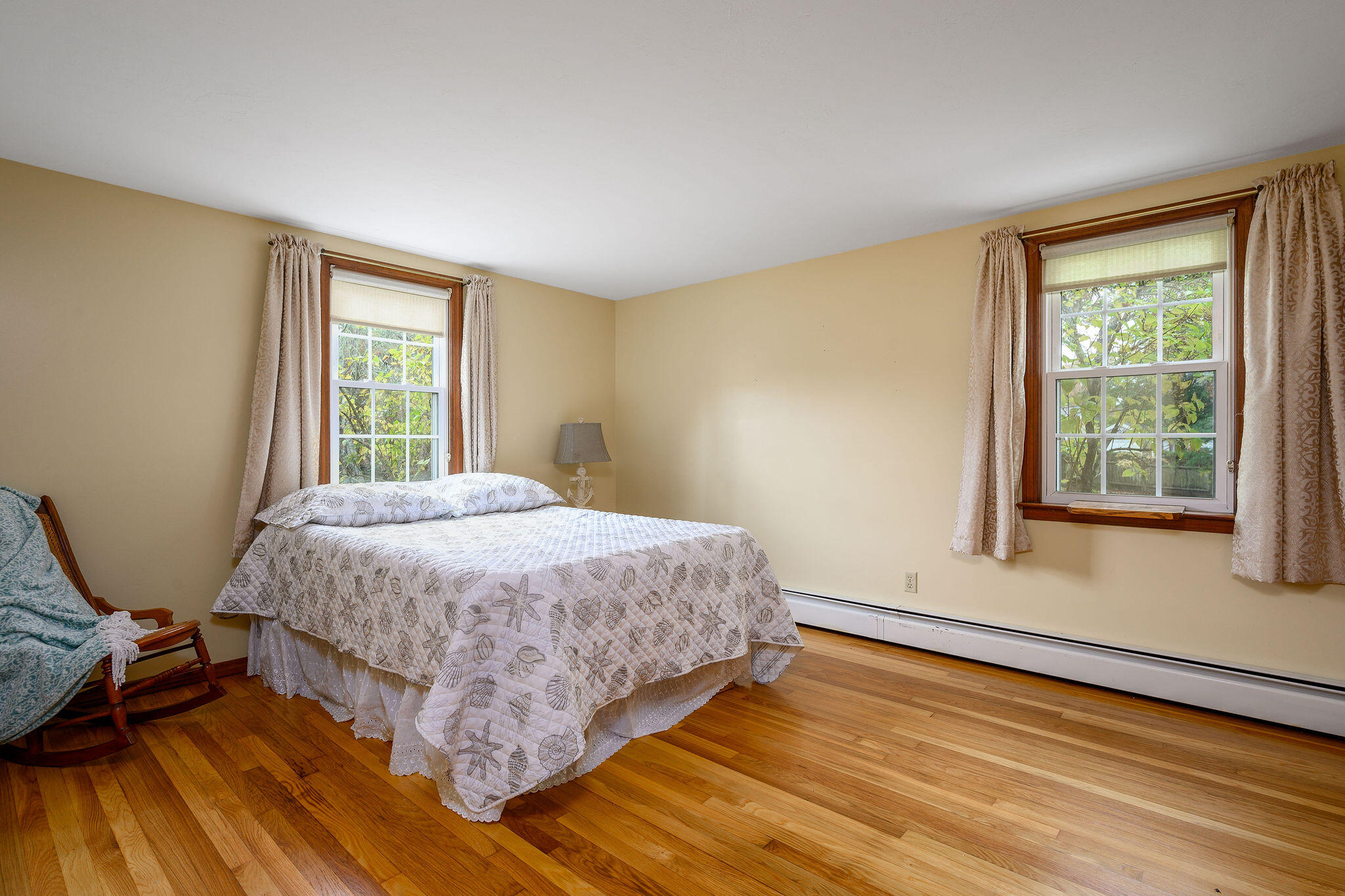 256 Buckskin Path Centerville, MA 02632 - Photo 20 of 38 a bedroom with a bed and wooden floor