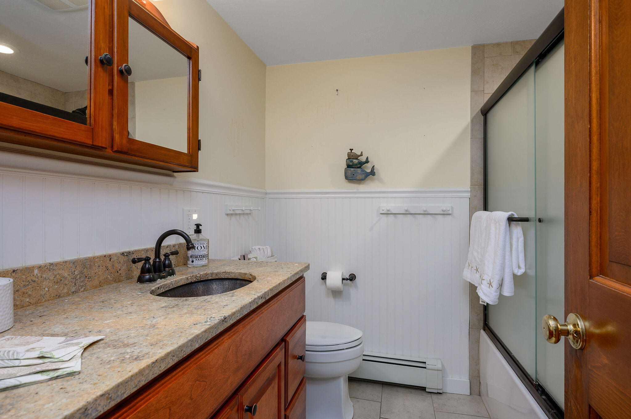 256 Buckskin Path Centerville, MA 02632 - Photo 22 of 38 a bathroom with a granite countertop sink a toilet and a mirror